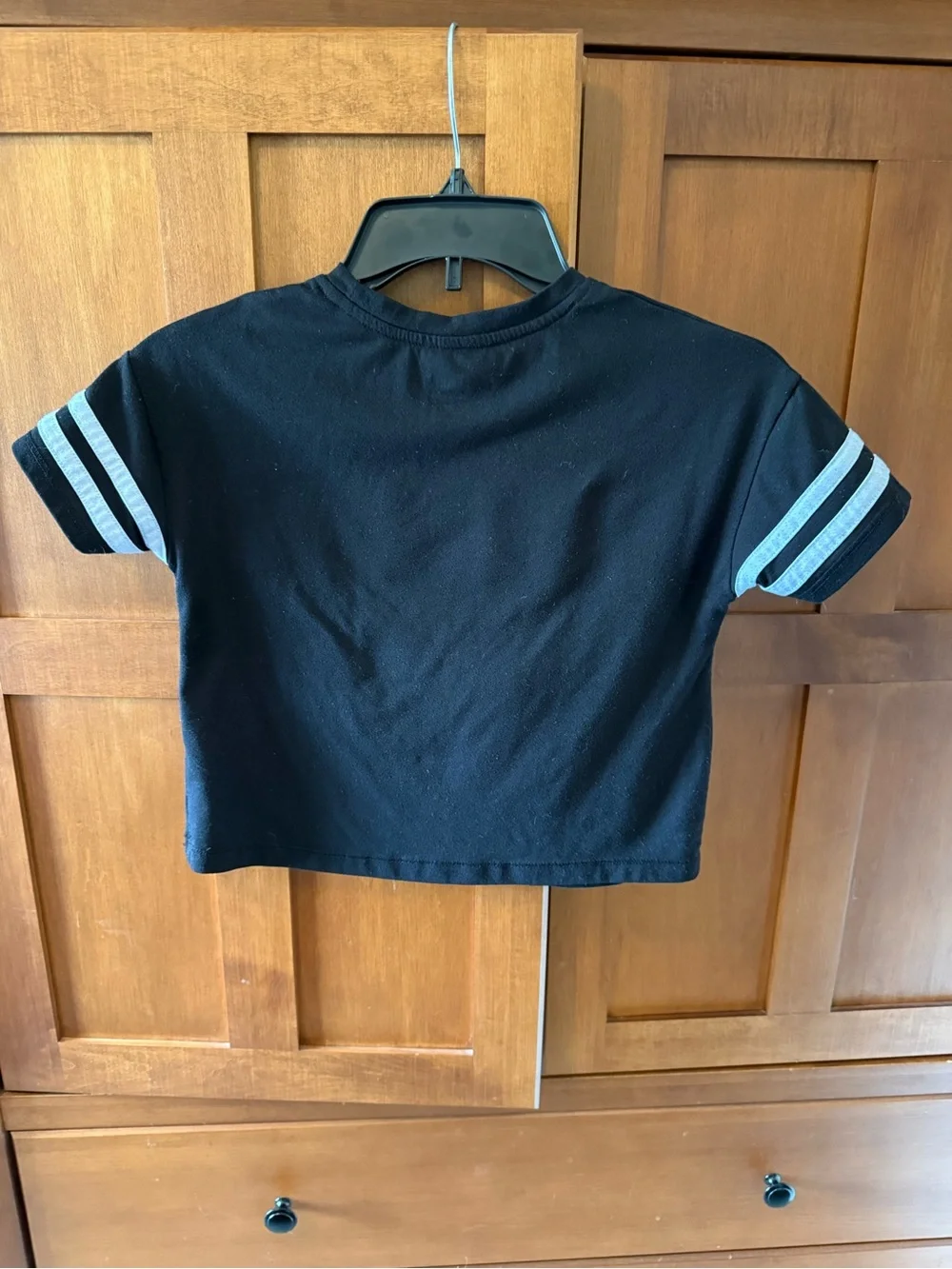Justice black tee with rainbow stripe